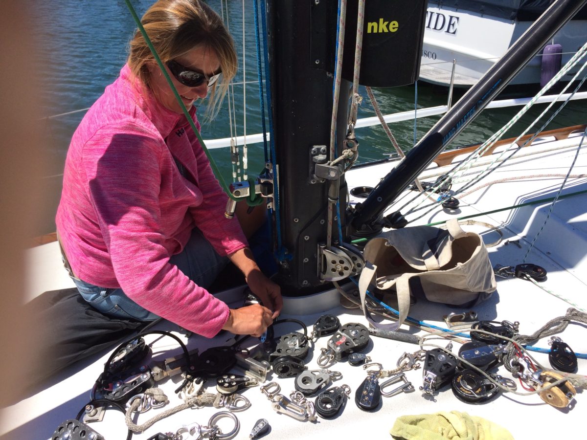 Lori working on rigging the spinnaker cars together